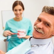 Smiling senior man in dental chair