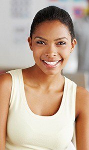 woman in tank top smiling