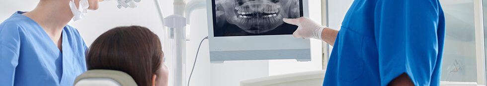 dentist pointing to x-ray