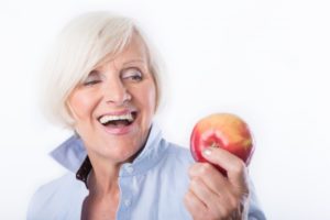 older woman with apple