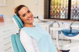 Smiling woman in the dental chair. 
